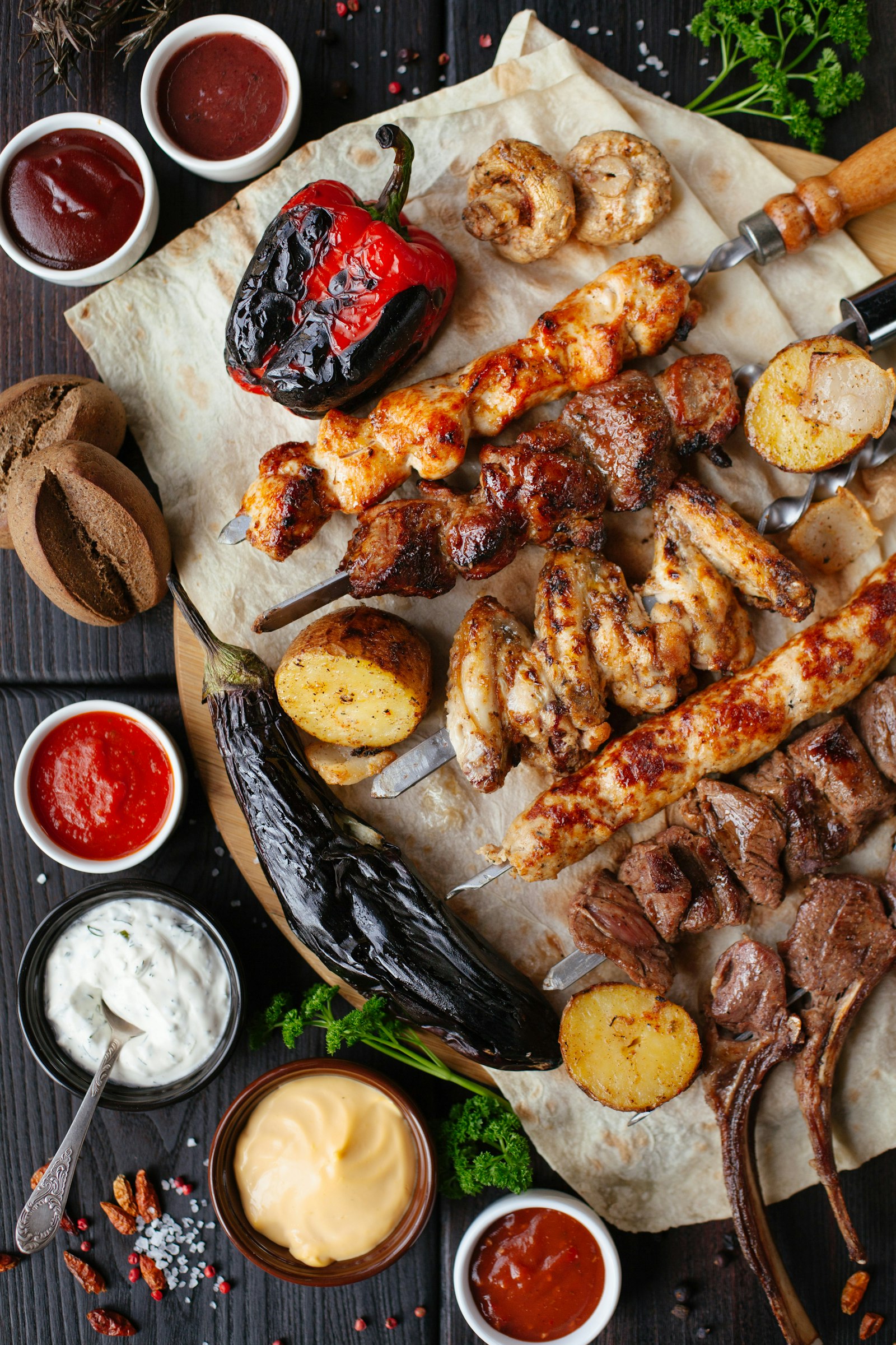 Grilled skewers of meat and vegetables on a table
