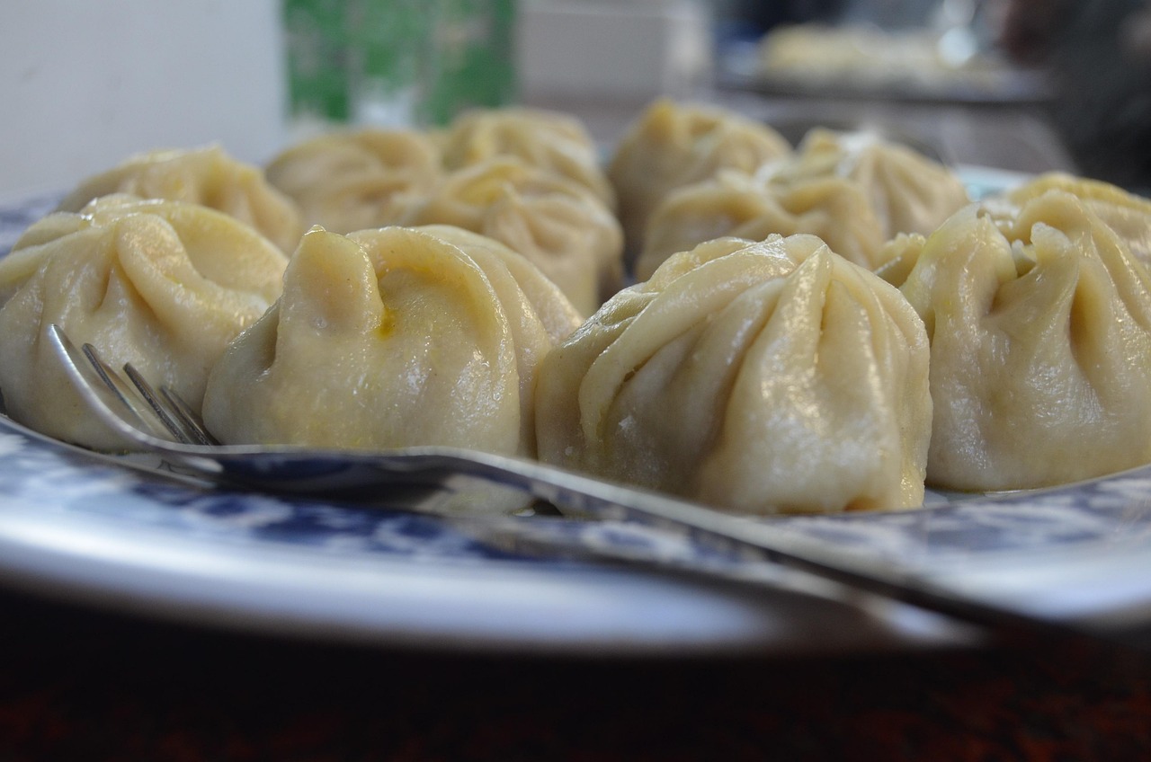 Xiao long bao soup dumplings in a bamboo steamer